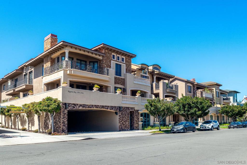 Perfectly situated near Coronado's historic Ferry Landing, this expansive single-level condominium offers the ideal blend of classic architecture with modern luxury. Designed with impeccable attention to detail, the home features solid wood floors, custom cabinetry, and high-end appliances that set a standard of quality throughout. French doors open to a generous wrap-around balcony with built in BBQ and ample room for entertaining. The serene primary retreat with it's spa-like bathroom provides a private haven of relaxation. Beyond the residence, the vibrant neighborhood places boutique shopping, fine dining and scenic waterfront pathways just steps away, with world class beaches, golf and yachting nearby.