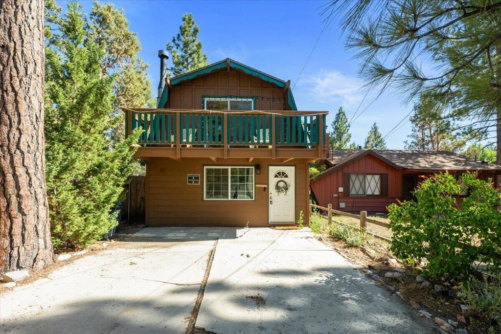 Adorable gambrel cabin in Bear City just on the border of Forest Spring. Great, quiet, well- established neighborhood for walking and getting to know your neighbors! It's a perfect mixture of full timers and rental cabins. It has a roomy addition for a bright and sunny laundry/mudroom or dining room, off the kitchen. Backyard has a flat paver patio and a nice sized storage shed. Gambrels are known for their spaciousness! It has a unique corner fireplace, 2 large bedrooms upstairs with balconies off one of the bedrooms and a good size bathroom right at the bottom of the staircase for easy access from upstairs. You want to put this one on your list to visit or show soon! Seller is motivated and ready to negotiate! Thanks for your interest and give me a call ( Lara), if you have any questions.