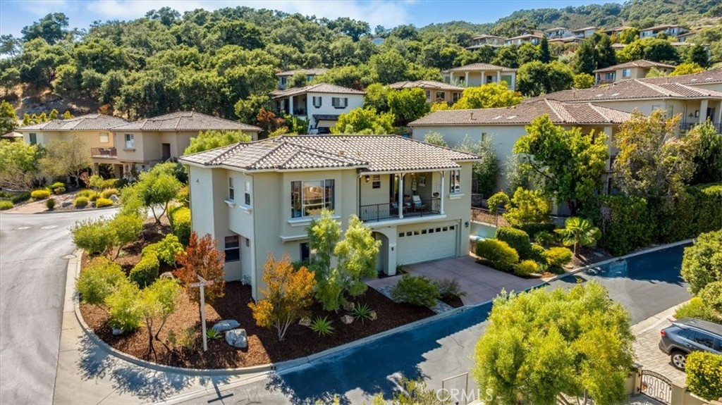Stunning Avila VIEW Home in Kingfisher Canyon. Situated in the guard gated charming community of San Luis Bay Estates. Outstanding views from upper floor and balcony. Large gated and fully fenced rear yard perfect for entertaining with room for pets and children. This is one of the largest and most usable corner lots in the community. Sunny micro climate. Beautiful landscaping with paver patio and custom iron fence. Citrus trees. olive trees and drought tolerant plants grace the backyard. New fresh interior and exterior paint. Solid wood panel interior doors. Upstairs Crown moulding and 5 inch baseboards. East/West exposure brings bright warm light into the home. Newer stainless appliances. Refrigerator and Washer and Dryer included. Property has always been Lovingly maintained by owners. MOVE IN ready. Come enjoy ALL that Avila Beach has to offer. Hiking galore, biking, golf, beaches, concerts, gourmet dining, wineries, farmers markets and more. Enjoy the good life in Beautiful Avila Beach