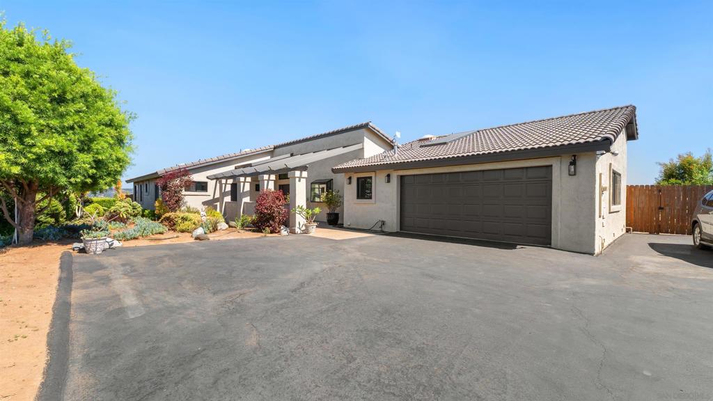 Discover your dream retreat in this immaculate 3-bedroom, 3-bath home nestled on a sprawling .84-acre lot in the heart of Bonsall. Enjoy ultimate privacy and a serene rural country feel, all just minutes from the freeway for easy access to everything you need. Step inside to find a spacious, light-filled interior with newer ceiling beams and panoramic views from every angle. The beautiful, expansive kitchen is perfect for both daily living and entertaining guests. Outdoors, new landscaping surrounds a charming potting shed and a fully fenced, large dog run—ideal for pet lovers and gardening enthusiasts alike. With abundant natural light, generous living spaces, and thoughtful upgrades throughout, this property offers the perfect blend of comfort and style. Don’t miss your chance to own this Bonsall gem.