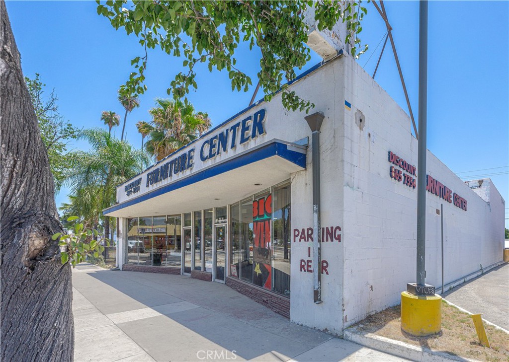 Free-standing store front with high visibility with on a street with approximately 20,000 cars passing daily. The building consists of about 5,000 sq. ft. of retail showroom and storage space on a 6,875 Sq. Ft. lot. The space provides the perfect setup for many uses with street and rear parking. There is an option to divide the space into two or more separate units with two existing front door entries. There is one single loading dock with roll up door in the rear as well as a large storage loft. Stop renting and own your own building. Currently owner operated furniture showroom.