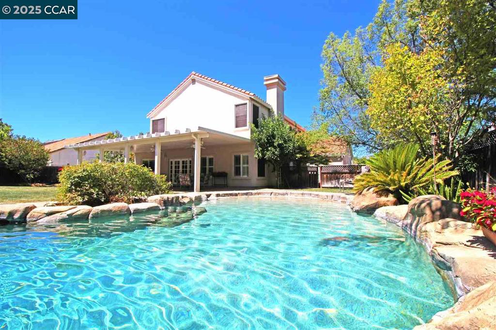 Stunning single family home featuring a massive 1/4 of an acre premium lot super private backyard with no rear Neighbors a stunning in-ground swimming pool with natural rock waterfall feature featuring three spacious bathrooms and three full bath with an office possible 4th bedroom plus a loft. An upgraded gourmet kitchen with granite countertops stainless steel appliances with Island & refrigerator. with custom patio cover on the backyard with plentiful play space beautiful curved stair rail and high ceilings with dual pane energy efficient windows Reese's lighting stucco exterior lifetime tile roof on a concrete slab Foundation truly built to last. Close to park schools and easy freeway access and close to shopping centers situated in the top rated schools in Brentwood. Newer furnace and AC compressor replaced a few years ago. Only about 8 minutes away from the mini BART train leading to San Francisco.