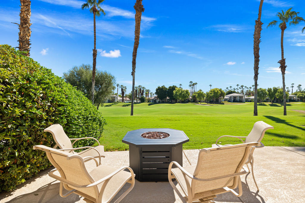 Located on the 2nd hole of the Palmer Private course at PGA West, this light, open and airy home offers 2 bedrooms, 2 baths + an office in a spacious 2,026 square feet! There is a large, well appointed kitchen with breakfast bar, and the great room features a cozy fireplace. The generous primary suite has a large bath with dual vanity and separate tub and shower, and an ample walk-in closet. Step outside to an oversized covered patio featuring a firepit and lovely views! And lastly there is a two car plus golf cart garage. This is a sought after floorplan, that rarely comes on the market. Come and experience resort living at its finest!