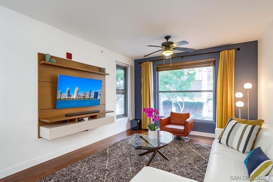 Craving a lifestyle where the city’s energy is right outside your door? This spacious 1-bedroom plus optional office/guest room at Metrome, in the heart of East Village/Gaslamp, delivers the ultimate San Diego downtown experience. With nearly 1,000 square feet of open, light-filled living, soaring ceilings, and a flexible layout, you’ll have room to work, play, and entertain with ease.  This fully remodeled unit shines with real hardwood flooring throughout, a sleek kitchen with two-tone cabinetry, quartz countertops, and stainless steel appliances, plus a spa-inspired bathroom featuring a large vanity, quartz counters, and a bath-shower combo. Modern finishes and thoughtful updates make it the perfect place to relax after a day of urban adventures.  Metrome enhances your lifestyle with top amenities, including a fully equipped state of the art gym, gated underground parking, a private secure storage unit, a stylish clubhouse with full kitchen, and a secure bike storage room—all with some of the lowest HOA fees in Downtown! Just one block from Petco Park and steps away from San Diego’s top restaurants, nightlife, and entertainment, this residence blends convenience with modern luxury. This is the one you’ve been waiting for—come see it before it’s gone!