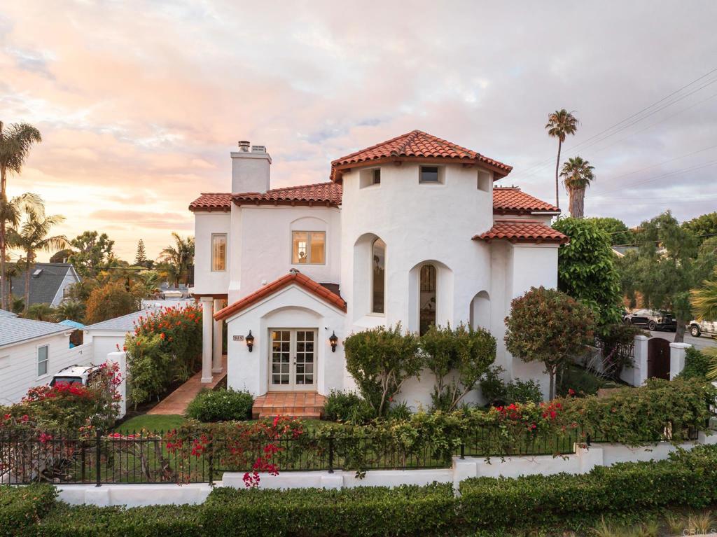 Tucked away on a peaceful corner in La Jolla's coveted Beach-Barber Tract, is a masterfully crafted Spanish-Eclectic residence that blends enduring architectural charm with understated modern elegance. Set behind a gated entry and framed by lush tropical landscaping, this home offers a rare sense of privacy just moments from the coastline. A graceful arched entry with an incredible one-of-a-kind front door, as well as a signature two-story turret, introduce the home's authentic character and charm while hand plastered walls, exposed wood beams, rich hardwood, stone flooring, and limestone stairs, reflect the warmth and romance of classic Mediterranean design. Timeless craftsmanship is evident in every detail, thoughtfully complemented by contemporary upgrades for effortless daily living. At the heart of the home, a gourmet kitchen is outfitted with high-end appliances and flows seamlessly into a breakfast nook, dining room, office and family room which is an inviting layout ideal for both intimate gatherings and larger celebrations. French doors open to a serene courtyard surrounded by mature greenery, where an outdoor kitchen and multiple seating areas create a private retreat for year-round al fresco dining and entertaining. Subtle ocean breezes and a sense of calm pervade the space, offering a truly tranquil escape. Located just blocks from the sand, and within easy reach of La Jolla's vibrant village, award-winning schools, bike trails, and Starkey Park, this amazing property is an exceptional opportunity to own a home of architectural significance in one of San Diego's most sought after neighborhoods. A must see to thoroughly experience everything this home has offer!