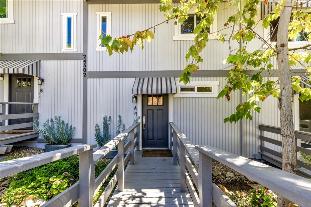 Charming Lantern Village Ground-Level Condo with Private Garden Retreat
Step into storybook charm with this beautifully remodeled ground-level condo, nestled in the heart of Dana Point’s coveted Lantern Village. From the moment you arrive, the Cape Cod architecture captures your heart. A quaint footbridge welcomes you home as the gentle sound of a bubbling creek flows beneath your feet—setting the tone for the serene ambiance within.
Inside, the residence showcases a light and airy design with a neutral palette, complemented by a cozy fireplace that invites warmth and relaxation. Enjoy the ease of indoor-outdoor living with both a spacious front deck and a private rear balcony.
A rare feature for condo living, this home boasts exclusive access to a private backyard oasis adorned with mature fruit trees, vibrant flowering plants, and whimsical garden pathways. Tucked within this lush sanctuary is a detached studio/shed—perfect for a home office, artist’s retreat, or meditation space.
The location is simply unbeatable. Stroll to Dana Point Harbor, local restaurants, charming boutiques, and enjoy world-class activities like fishing, whale watching, and all your favorite water sports.
This is more than a home—it’s a peaceful retreat in a picturesque coastal village.