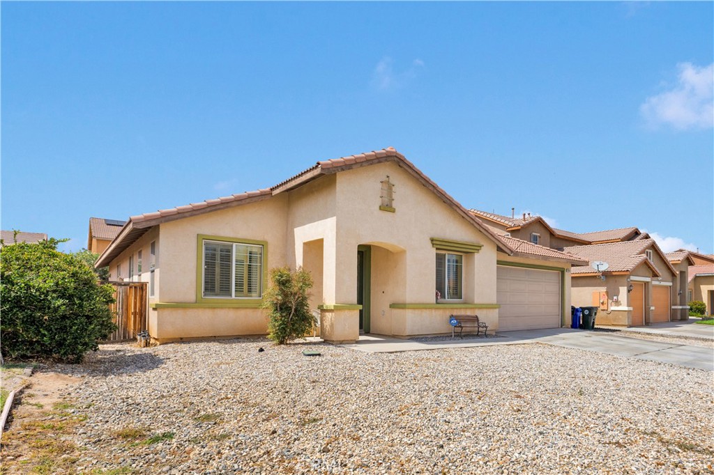 Spacious and inviting, this 4-bedroom, 2-bathroom home offers 2,374 sq. ft. of comfortable living in a quiet Victorville neighborhood. The open floor plan features a generous living room and a cozy family room with a fireplace, perfect for gatherings or quiet evenings in. The bright kitchen flows seamlessly into the main living areas, making entertaining a breeze. The master suite is a true retreat with a large walk-in closet, a relaxing garden tub, and a separate walk-in shower. Three additional bedrooms provide plenty of space for family, guests, or a home office. Convenient in-home laundry room adds everyday ease. Outside, enjoy the privacy of a peaceful street, with a 2-car attached garage offering parking and storage. This home has all the space, opportunity and features you’ve been looking for, just needs some updating and your TLC to call it home.