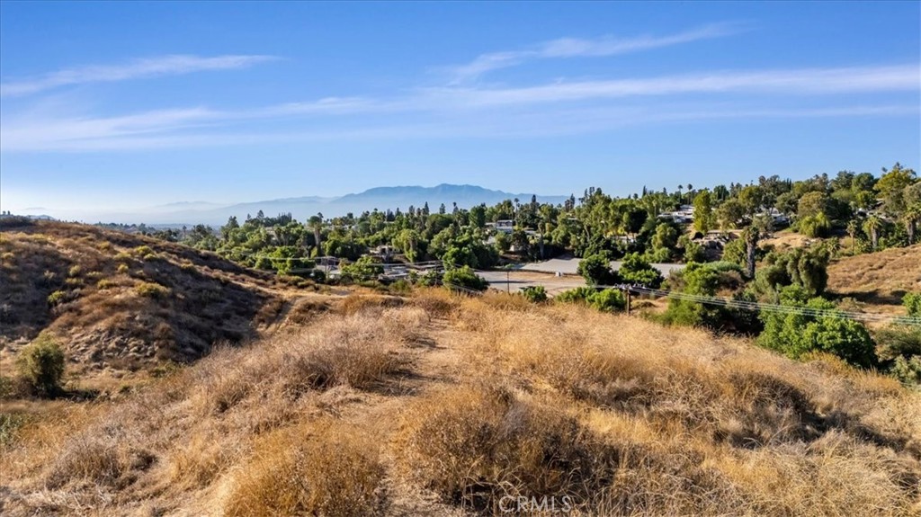 ***AMAZING 1.03 ACRE LOT in MOCKINGBIRD CANYON*** This unimproved 1.03 Acres has STUNNING VIEWS of City Lights and Snow-Capped Mountains. This is the perfect place to Build a DREAM HOME or Compound (other lots available). Custom Homes in the area are selling up to $2 MILLION. This Amazing View lot is surrounded by Beautiful Custom Homes and has the most AMAZING SUNSETS you will experience!!! Close to major freeways. Dining and Entertainment is only 10 minutes away including the Historical Mission Inn Downtown. Low Tax Rate and No HOA too!!