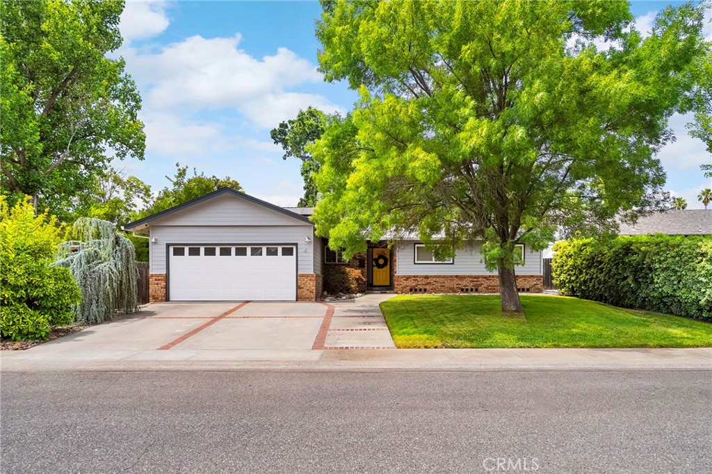This Lower Bidwell Park neighborhood home has incredible curb appeal. Just two blocks from the entrance to countless biking and walking trails and positioned just about equal distance between One Mile and Five Mile parks. There are 3 bedrooms, 2 bathrooms, an oversized kitchen and separate dining room. The family room blends into the living room and showcases a stunning coved fireplace and hearth which is the centerpiece of the the common area. There is no shortage of cabinetry or counter space in the kitchen which also includes stainless steel appliances and a gas stove. All 3 bedrooms are ample size with large windows to bring in the natural light. Both bathrooms have been updated. The primary ensuite features dual vanities with backlit mirrors and a walk in shower. French doors lead to an enclosed patio sunroom and indoor laundry. Plenty of room for toys and storage in the 2 car garage. Solar Energy Panels are owned. Close proximity to Sierra View Elementary and Hooker Oak Park.
