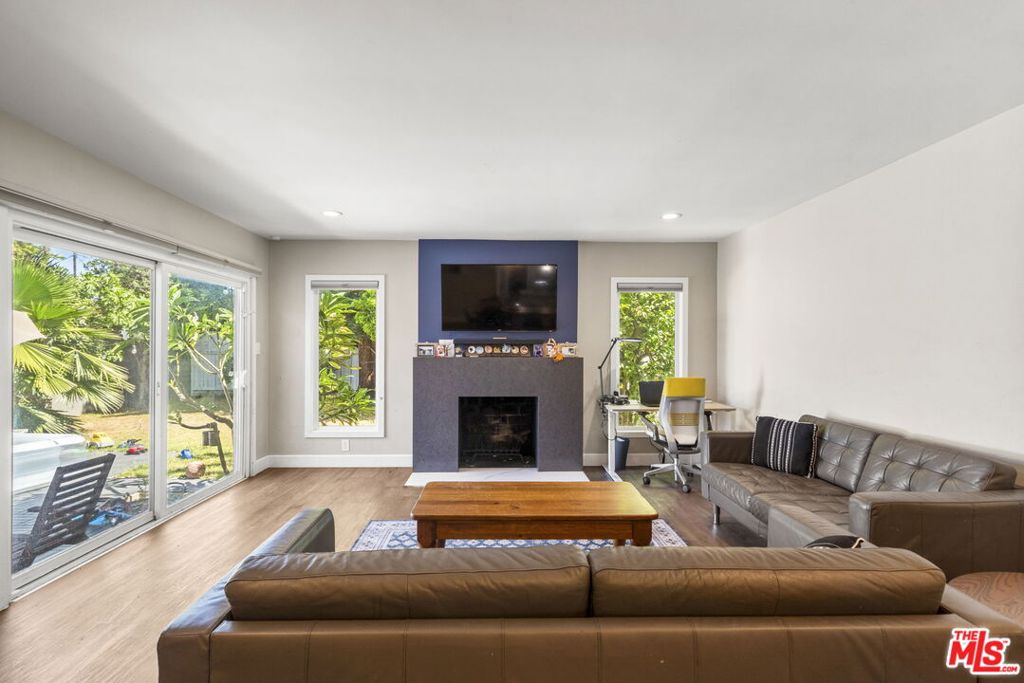 Welcome to 14034 Valerio Street, a beautifully remodeled mid-century gem with solar panels (included with rent), nestled in the heart of Van Nuys. This spacious 4-bedroom, 2-bathroom home offers a perfect blend of classic charm and modern updates, making it an ideal fit for a wide range of rentersfrom families and professionals to retirees or anyone seeking a turnkey property with thoughtful amenities. Located behind a secure gate, the home features a generous front yard and a fully fenced backyard with a private patio, perfect for entertaining, relaxing, or letting kids and pets play safely. The interior boasts a light-filled open-concept layout with contemporary finishes, a sleek modern kitchen, and updated bathrooms designed for comfort and style.In addition to ample living space, the property includes a convenient attached two-car garage equipped with an **electric vehicle (EV) charger**, offering both parking and modern functionality. A **detached bonus structure in the backyard**, previously used as a home office, provides extra flexibility for remote work, hobbies, or storage. The home is centrally located just minutes from grocery stores, parks, and public transportation, with easy access to both the 405 and 101 freewaysideal for commuters. Enjoy the walkable neighborhood with local shops and dining nearby, and spend weekends at Lake Balboa Park, which is about 10 minutes away.This home is also well-positioned for those with education in mind. It's part of the Los Angeles Unified School District, with nearby options including Valerio Street Elementary, Robert Fulton College Preparatory, Panorama High School, Hazeltine Avenue Elementary, Daniel Pearl Magnet High School, and Birmingham Community Charter High School. Whether you're looking for a stylish family residence, a comfortable and efficient work-from-home setup, or simply a place to call home in the vibrant San Fernando Valley, this move-in ready property delivers comfort, flexibility, and timeless appeal.