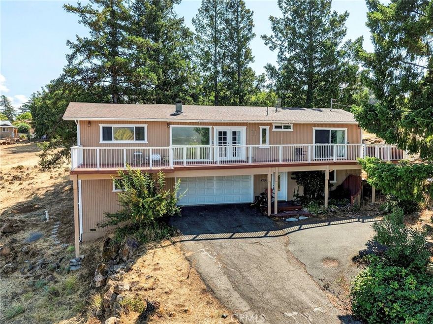 Discover your dream home with stunning lake views and access to a golf course! This spacious property, situated on two merged lots and backing directly onto the 6th fairway, is a perfect canvas for your vision. The upstairs living area includes two bedrooms and two bathrooms, offering comfort and privacy. The gourmet kitchen features a stylish granite island, Corian countertops, and ample pantry space, along with a cozy dining area ideal for family gatherings. The family room invites relaxation, while the decks provide a perfect spot to soak in the breathtaking views. Additionally, there’s a laundry area upstairs and a third bedroom, bath, and recreation room downstairs, perfect for fun and activities. With a two-car garage and a huge workshop, there’s plenty of room for your hobbies. While this home has incredible potential, it does require some cosmetic work to truly make it shine. Located close to the lake, renowned wineries, and many attractions of Lake County, this property combines luxury and leisure, making it the perfect opportunity for those looking to add their personal touch. Don’t miss out on this rare chance to own a piece of paradise—schedule your showing today!