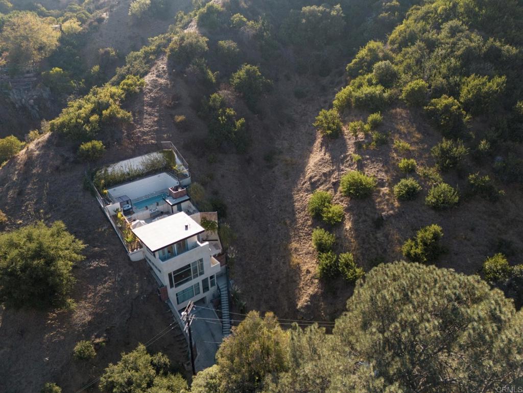 Discover a rare gem in the heart of Hollywood Hills! This unique parcel offers stunning views of Los Angeles, surrounded by iconic attractions like the Hollywood Bowl, Griffith Observatory, Runyon Canyon, and the legendary Sunset Strip. Perfectly positioned, this land brings the best of L.A. to your doorstep, from celebrity hotspots to serene hiking trails like the Hollywood Reservoir. Beyond location, this property is a prime investment in one of the city's most prestigious neighborhoods. With limited land availability, property values here are on a steady rise. Build your dream home or a lucrative rental in an area where exclusivity and demand ensure long-term value. Whether you're looking to settle in a world-renowned locale or make a strategic investment, Hollywood Hills provides unmatched lifestyle and growth potential. Don't miss this rare opportunity to own a piece of Hollywood!