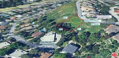 Photo of 22528 Uhea Road, Woodland Hills, CA 91364 (MLS # 25559179)