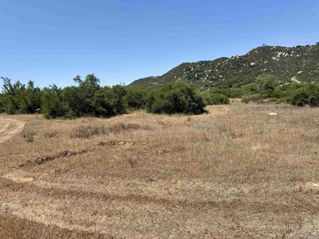 Nestled in the heart of Mt Olympus Estates, this stunning 10-acre parcel offers a rare opportunity to build your dream home or ranch in a peaceful, panoramic valley. Surrounded by majestic mountains and scenic rock outcroppings, the property enjoys sweeping views of Gomez Creek and a tranquil, natural setting. The land features flat to gently sloping terrain with a slight rise, perfect for a future homesite. Enjoy the convenience of a 24-ft wide paved road, underground power and water at the property, and a 3-bedroom septic layout already on file. With dual access points, this lot is ideal for horses, outdoor living, and all your toys. Mt Olympus Estates offers a blend of seclusion and accessibility—just minutes from I-15, yet a world away in peaceful ambiance. This is a rare blank canvas to create the lifestyle you’ve always envisioned.