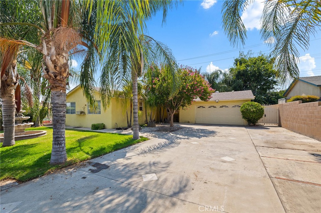 Welcome to this spacious 4-bedroom, 2-bath home in San Bernardino, just minutes from Yaamava’ Resort & Casino. Sitting on a generous lot, this 1,500 sqft home offers upgraded flooring throughout, a dedicated laundry room and a layout that works for both everyday living and entertaining. Step out back and you’ll find a lush garden with mature trees and plenty of shade — perfect for relaxing evenings or weekend get-togethers. The oversized driveway has room for multiple vehicles, plus space for your RV or boat. A solid home in a great location with room to grow — come check it out!