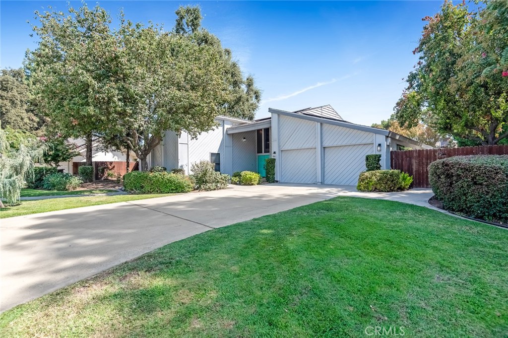 Welcome to your dream home in the sought out neighborhood of Encino Park in Tulare! Step into this stunning 3-bedroom, 3-bath home plus a spacious den currently being used as a 4th bedroom, offering over 2,400 sq. ft. of beautifully designed living space. Featuring dramatic vaulted wood ceilings with exposed beams and a classic masonry fireplace, the home blends warmth and character with modern comfort. The spacious loft adds flexibility for a home office, media room, or guest space. The primary suite is a true retreat with direct access to a private atrium, perfect for quiet mornings or evening relaxation. Outside is over 11,200 sq. ft. lot, enjoy the sparkling pool and inviting outdoor spaces ideal for entertaining or unwinding. With its unique architectural details and thoughtful layout, this home is a rare find that combines charm, functionality, and style. Don't miss out—schedule your tour today!