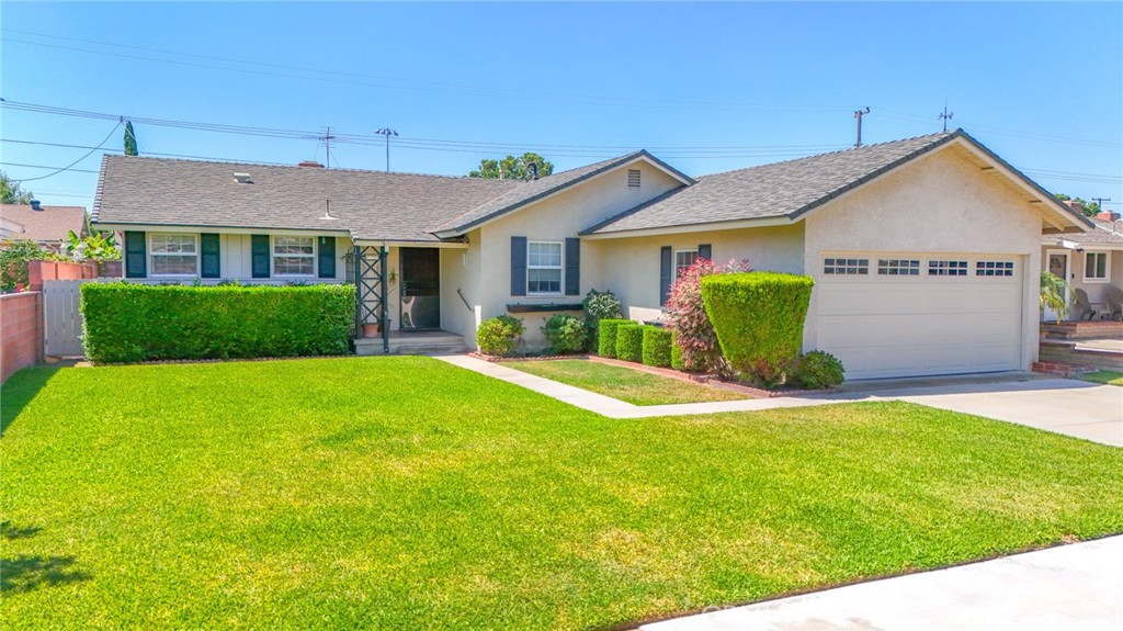 Wow! Wow! Wow! What a Great Home located in the heart of Buena Park, Great Curb Appeal and in a Nice Neighborhood, Home has 4 Bedrooms /2 full Bathrooms, Livingroom with Brick Fireplace with Custom Mantle, Plush Carpeting in Livingroom and all Bedrooms, Nice Family Kitchen with lots of cabinet space & Laminate Flooring, dining off Kitchen and Livingroom Area, Master Bedroom with Master Bathroom w/Walkin Shower, Good Size Bedrooms all with Ceiling Fans and Carpet, Central Air/Heat, Roof is newer 12 yrs, Newer Double Paned Windows, Covered Patio in Backyard and Large Backyard with Grass, 2 Car Garage, Close to all that Buena Park has to offer, Knotts Berry Farm, Shopping, Restaurants, Entertainment Centers, Freeways, and So Much More..