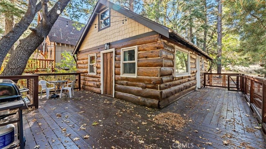 Embrace the beauty of mountain living in this authentic log cabin, perfectly set against the breathtaking backdrop of the San Bernardino National Forest. With direct access to some of the area’s best hiking trails just steps from your front door, this home is a true nature lover’s paradise. Located only one block from Bear Mountain Ski and Golf Resort, the opportunities for four-season adventure are endless—from skiing and snowboarding in the winter to golfing, biking, and lake activities in the summer.



This charming cabin offers 3 bedrooms, 1 full bathroom, and 938 sq ft of living space on a generous 5,000 sq ft lot. The thoughtful layout features one convenient main-level bedroom and two loft-style bedrooms upstairs, making it perfect for guests, family, or even a home office. Inside, you’ll find a warm and inviting living room centered around a striking native rock wood-burning fireplace, creating the ideal setting for cozy evenings after a day on the slopes. Recent upgrades include new vinyl plank flooring and a fully rebuilt bathroom, blending modern comfort with rustic character.



Step outside to enjoy the expansive entertainer’s deck, where you can take in stunning views of the mountains and surrounding forest. The beautifully landscaped yard and fully fenced backyard provide both beauty and privacy, offering the perfect retreat for barbecues, gatherings, or quiet evenings under the stars. A level lot with driveway parking adds everyday convenience to this serene mountain escape.



Whether you’re seeking a full-time residence or a vacation getaway, in a highly desirable year-round destination, this log cabin offers it all. With its unbeatable location near Bear Mountain, Big Bear Lake, and charming village shops and dining, this home delivers the rare blend of rustic charm, modern updates, and outdoor adventure. Don’t miss the opportunity to make this mountain retreat yours—schedule your private showing today!