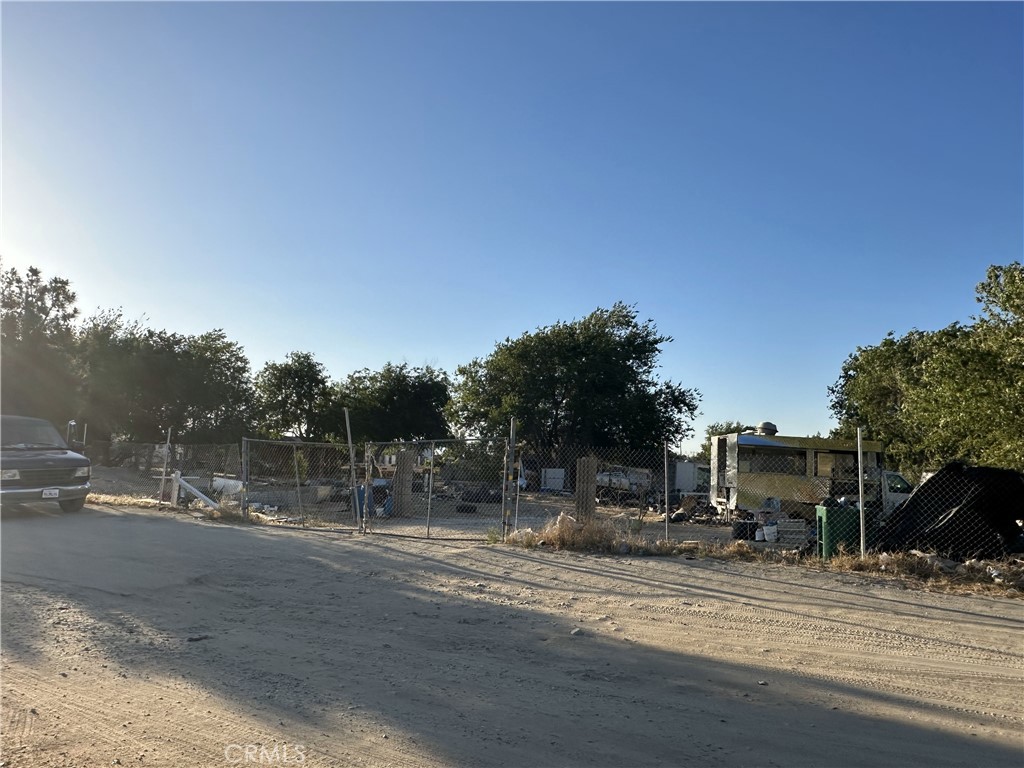 Incredible opportunity to acquire a large 46,661 square foot parcel in the growing city of Palmdale. Perfectly positioned near major shopping centers and conveniences, this expansive lot offers outstanding potential for future development, investment, or commercial use. The property is street accessible with perimeter fencing and mature tree coverage, offering both function and flexibility. This lot delivers versatility, visibility, and value. Buyer to verify zoning and usage possibilities.