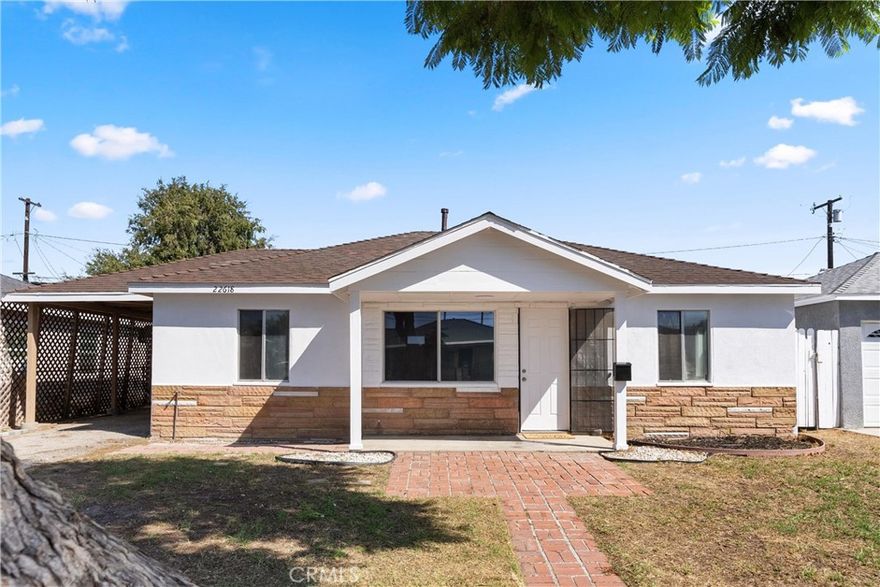 Welcome to 22618 Island Avenue, a beautifully refreshed home on a spacious lot in Carson. This single-level, 3-bedroom, 1-bath residence has been thoughtfully updated and is move in ready.

Inside, you will be greeted with brand new luxury vinyl plank flooring, freshly painted walls and lots of natural light. This home has three generous sized bedrooms each with plenty of closet space and smooth ceilings. The remodeled bathroom features subway tile and modern finishes, while the kitchen offers freshly painted cabinets, plenty of storage, and a brand-new stove that’s ready for your first home cooked meals. This home also has inside laundry to keep daily living convenient.

Step outside and marvel at the large backyard with endless potential. Imagine summer barbecues, or adding a pool, or even an ADU. The covered carport and long driveway give you plenty of parking and flexibility.

All this, plus a central location near parks, shopping, and freeway access that makes commuting and weekends a breeze.

If you’ve been waiting for the right place to make your move into homeownership, 22618 Island Avenue is it. Fresh, affordable, and full of potential.