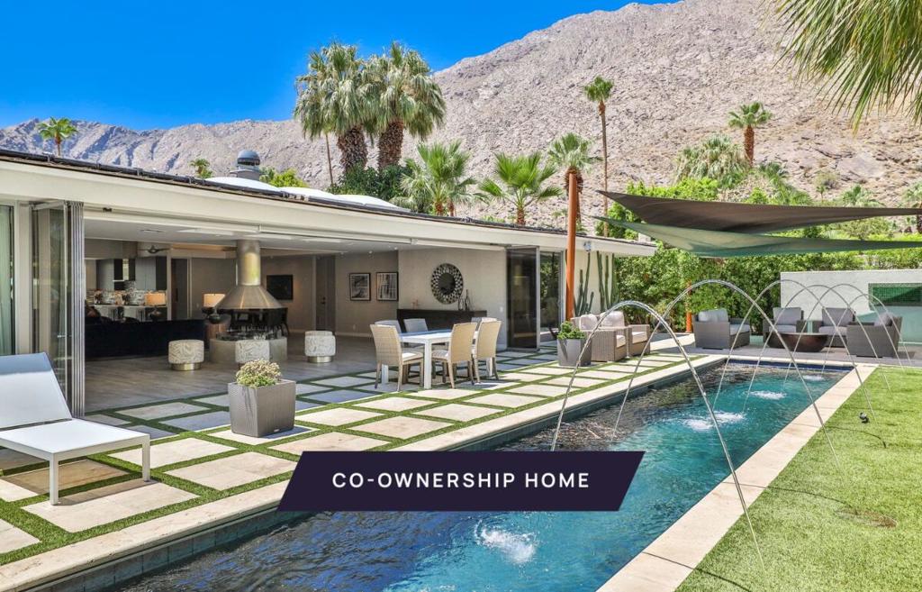 New co-ownership opportunity: Own one-eighth of this turnkey home, professionally managed by Pacaso. This head-turning 4-bedroom, 5-bath home lies in the heart of Palm Springs' Historic Tennis Club neighborhood. The sophisticated single-level home offers stunning views of the San Jacinto Mountains and expansive entertaining spaces inside and out. Vast and vaulted, the bright great room features a wall of windows with unobstructed sightlines to the private outdoor space with a distinctive focal point: a sparkling lap pool with six arcing fountains and a spa. The great room also features a striking free-standing fireplace with round stainless steel hood. The sleek look continues in the kitchen with stainless appliances, modern cabinetry, a massive island and a wall that opens to a covered patio space for dining and relaxing. The home has four sleek bedroom suites, ensuring there's plenty of space for everyone to have their own private oasis. Solar panels on the roof are perfect for sunny Palm Spring days. In addition to being next to the Tennis Club, this property is close to hiking trails and downtown Palm Springs. The home comes fully furnished and professionally decorated.