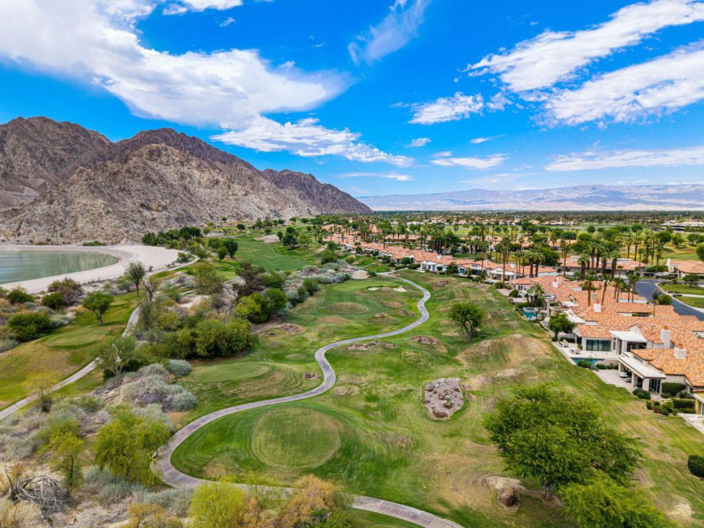 Escape to luxury and leisure in this stunning 4-bedroom, 5-bath seasonal retreat located on the 17th hole of the exclusive Nicklaus Private Course at PGA West. With dramatic, unobstructed views of the Santa Rosa Mountains, this home offers a front-row seat to the beauty and serenity of the desert--perfect for your next extended getaway.Ideal for hosting family or guests, the layout features four beautifully remodeled en-suite bedrooms, including a private detached casita for added comfort and privacy. Each suite is appointed with upscale finishes and designed to provide a relaxing, resort-like experience.The spacious open-concept kitchen is fully equipped with stainless steel appliances, sleek quartz countertops, a generous island, and ample seating for entertaining. Whether you're preparing dinner or enjoying cocktails after a day on the course, this space makes gathering effortless.The heart of the home is the bright, Great Room perfect for unwinding, with plush designer furnishings, an elegant gas fireplace, and an 85'' TV ideal for movie nights or game days. Walls of glass invite the outside in, revealing sweeping mountain and fairway views that never get old.This fully furnished seasonal rental, has been thoughtfully curated with custom decor, high-end furnishings, and everything you need for a seamless extended stay. From plush, hotel-quality linens to a fully stocked kitchen, every detail has been considered to ensure maximum comfort and style. Enjoy high-speed Wi-Fi throughout the home, perfect for work or streaming. Just two doors down, you'll find sparkling community pools and relaxing spas--ideal for soaking up the sunshine and unwinding after a day on the course or exploring the desert. For added convenience and fun, a golf cart is also available for use during your stay for an additional fee.Whether you're here for golf, sunshine, hiking, or simply a peaceful escape, this home is the perfect base for enjoying everything the desert has to offer. Please reach out to confirm availability. NOT available for March and April 2026