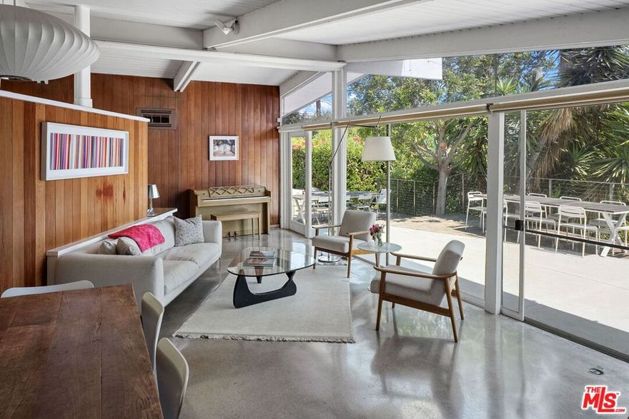 Discover Architectural Elegance in Brentwood.  Welcome to the Siegel House at 12400 Deerbrook Lane, a rare Mid-Century Modern gem nestled in Crestwood Hills. Designed in 1950 by acclaimed architect A. Quincy Jones, this historically significant residence was the first built home of the planned 500 homes in this area. This single-story home offers three bedrooms and 1.75 bathrooms, with hallmark redwood post-and-beam construction and polished cement floors throughout. An open floor plan, large windows allow constant natural lighting, remodeled kitchen, framed by eight-foot sliding glass doors, creates a seamless indoor-outdoor flow, expanding the living space into the private, tranquil grounds with never ending views to the Ocean and city lights from the private patio area. In addition, enjoy the lower back yard for picnics or reading a book. Beyond its architectural significance, the property presents an exceptional opportunity: potential for historic designation and the associated Mills Act tax savings. Both a residence and a piece of design history, the Siegel House invites its next steward to preserve, enjoy, and make it their own.