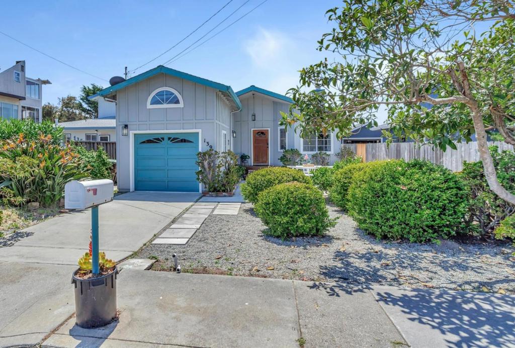 Ideally located property just one home behind iconic West Cliff Drive in Santa Cruz, Clark Avenue is a hidden gem! Quiet street yet just moments to the ocean and world class surfing. The single level home features vaulted ceilings & fireplace in the living room + an open concept floor plan with the kitchen open to the living area. The kitchen was recently updated with new quartz countertops, gas stove and new kitchen sink & faucet. There is a breakfast bar plus a nice dining area and a pantry. The primary bedroom is spacious and has vaulted ceilings & skylight plus a bonus loft area. Plenty of space to enjoy the outdoors in the front yard patio or the rear yard which does have some ocean peaks. Welcome Home!