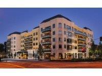 Experience upscale living in this beautifully appointed luxury condominium, ideally located within walking distance to San Mateo's finest shopping, dining, and entertainment. Enjoy an exceptional range of on-site amenities, including chef-prepared meals, weekly housekeeping, a well-stocked library, and a lively game room. Unwind in the indoor heated pool and Jacuzzi or take in stunning panoramic views from the rooftop garden complete with a walking track and putting green. Inside, the residence features expansive windows that flood the space with natural light, a beautiful kitchen with granite countertops and lots of counter space and cabinets. The primary bathroom has gorgeous tile floors, a marble countertop with dual sinks, and a walk-in shower. The second bathroom ensuite has a soaking tub, tile floors, and a marble countertop. Brand new carpet in the bedrooms and family room, and hardwood floors throughout. This condo showcases elegant millwork throughout, such as built-in cabinets, beautiful molding and a bookcase in the family room.
