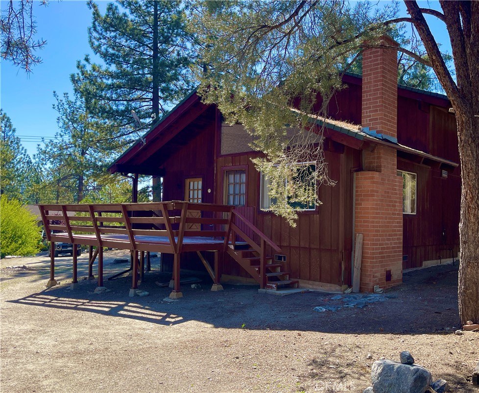 Nestled at the edge of the Los Padres National Forest, this charming four-bedroom, two-bathroom mountain home offers privacy, peace, and access to everything Pine Mountain Club has to offer. Just a short walk to the clubhouse, pool, and town center, yet tucked away behind tall trees, this is the perfect full-time residence or weekend retreat.
Step inside to a sunlit country kitchen equipped with a dishwasher, electric stove, range hood, and a built-in household desk with bookshelves — ideal for keeping your home organized. The cozy living room features soaring vaulted ceilings and a classic brick wood-burning fireplace to gather around on cool mountain nights.
On the main level, you'll find two bedrooms with large closets and a full bath. Upstairs, two more generously sized bedrooms share another full bathroom. Every window offers a peaceful view of the woods and surrounding neighborhood, making the home feel like a true nature retreat.
Outside, you'll enjoy a generous deck, front and backyard, great for entertaining, gardening, or just soaking in the fresh mountain air. The large lot offers ample space to add a garage if need.?? Community Amenities Include:
Pool & clubhouse
9-hole golf course & fishing pond
Horse stables & riding trails
Private campground & dog park
Snow removal & maintained roads
Children’s playground, restaurants, gift shops & more
Charter school nearby (K–8)
Whether you’re raising a family or escaping the city, this warm and inviting home offers the best of mountain living — all within a vibrant, amenity-rich community.
