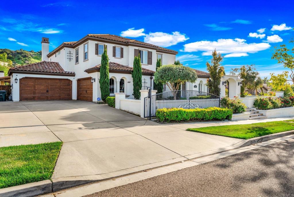 Welcome to 2010 Corte Belmarina, a beautifully maintained Mediterranean-style home located on a quiet cul-de-sac in the sought-after San Miguel Ranch community of Chula Vista. This spacious residence offers 6 bedrooms, 4.5 bathrooms, and approximately 4,625 square feet of well-designed living space on nearly half an acre. The home features a bright and open floor plan with high ceilings and large windows that bring in an abundance of natural light. A gourmet kitchen is at the heart of the home, complete with stainless steel appliances, custom cabinetry, a large center island, and ample counter space perfect for both everyday living and entertaining. The formal living and dining rooms flow into a generous family room. The primary suite offers a spa-style bathroom with dual vanities, a soaking tub, a walk-in shower, and a spacious walk-in closet. Additional interior highlights include hardwood flooring, an indoor/outdoor surround sound system, and a whole-home water softener with a reverse osmosis drinking water system. Step outside to a resort-style backyard designed for enjoyment and entertaining. The outdoor space includes a pool, spa, fire features, and a fully equipped outdoor kitchen with a cabana. There’s also a private playground area, a large lawn, and beautifully landscaped grounds. A gated driveway leads to a 4-car garage with epoxy flooring. The property also features a whole-home solar system for energy efficiency and has space for a potential guest casita or ADU. This home offers a great combination of style, comfort, and functionality, all in a peaceful, well kept neighborhood with access to parks, trails, and top-rated schools.