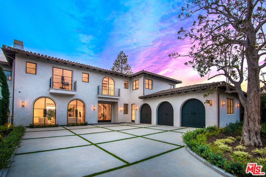 One of the few homes with ocean views on S. Rockingham, this newly constructed Spanish estate in prime Brentwood Park evokes the coastal charm of Santa Barbara with warm, contemporary interiors throughout. Behind gates on a flat, &#190; acre lot, the home showcases impeccable craftsmanship and an indoor-outdoor flow that defines the California lifestyle. Highlights include an exquisite chef's kitchen with triple islands and family room with fireplace and indoor-outdoor bar. Upstairs holds 4 ensuite bedrooms and a spectacular ocean-view master with a fireplace, balconies, marble bathroom and showroom closets. A lower level includes a theatre, bar, wine room, indoor-outdoor fitness center and sauna. An incredible backyard features loggias, a pool, spa and grassy lawn that spills over ocean and Riviera views. Complete with an elevator and a stone's throw from the Brentwood Country Mart, this extraordinary home offers a refined coastal living experience unequaled in the neighborhood.