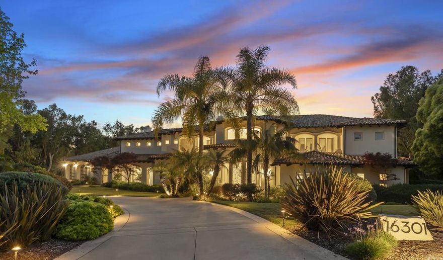 Positioned on 2.54 private acres in the guard-gated community of Fairbanks Ranch, this 9,204 sq. ft. custom estate has been thoughtfully reimagined with vast upgrades—offering a rare blend of refined luxury, smart innovation, and everyday livability. Step inside to sun-drenched marble floors, soaring ceilings, and a beautifully remodeled chef’s kitchen outfitted with smart appliances, marble countertops, custom cabinetry, and a zip faucet for instant filtered water. The expansive great room flows effortlessly into formal living and dining spaces, creating the perfect setting for everything from elegant entertaining to intimate family gatherings. A newly added 10-seat home theater with heated, massaging chairs offers a true cinematic escape, while a dedicated home gym brings fitness and wellness into daily life. Upstairs, dual primary suites offer spa-like bathrooms with steam showers, a sauna, and custom-designed closets—ideal for multi-generational living or luxurious guest quarters. New carpeting, fresh paint, LED lighting, and upgraded HVAC systems ensure comfort and efficiency throughout. Outside, the estate transforms into a private resort. A resurfaced saltwater pool with new coping and limestone decking is framed by lush lawns, smart landscape lighting, and tranquil koi ponds that invite slow mornings and peaceful reflection. The putting green, detached guest house, epoxy-coated oversized 1246 sf garage, and new wrought iron smart entry complete this move-in-ready sanctuary.