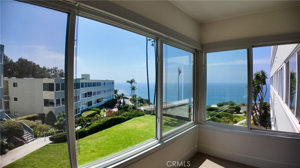 Experience coastal bliss in this stunning, condo nestled atop a bluff with breathtaking ocean views and an array of luxurious amenities! Situated on 9 acres of lush, gated property, this private, secure community offers everything you need to live the ultimate coastal lifestyle. Enjoy relaxing by the sparkling swimming pool, stroll through the manicured grassy belt with palm trees and eucalyptus for an endless vacation vibe. You’ll have exclusive beach access via a private, locked gate – it’s like having your own secret paradise! Inside the kitchen, white painted wood cabinets, stainless steel Frigidaire double door with bottom pull-out freezer drawer, new electric stove/oven, recessed lighted drop ceiling, white ceramic tile countertops – perfect for cooking and entertaining. The space flows seamlessly into the open living area, with wall-to-wall carpet in the living room and bedrooms, offering a cozy and inviting atmosphere. This condo boasts 1 & 3/4 baths and offers generous indoor living space, including a sunroom that adds even more charm and natural light. The actual interior is larger than the assessor's records, giving you even more room to relax and unwind. Included in the HOA: water, trash, basic cable, and access to the clubhouse and common laundry facilities. Two convenient parking spaces – in the underground garage #157 & 161 with storage locker available– make this condo as practical as it is beautiful. Light, Bright and Airy with ample view windows, private mailboxes, security cameras, and a gated community, your peace of mind is ensured. Live in the lap of luxury while still enjoying a secure, comfortable, single-level home where coastal dreams come true. This is more than a condo—it’s a resort lifestyle. Make it yours today!