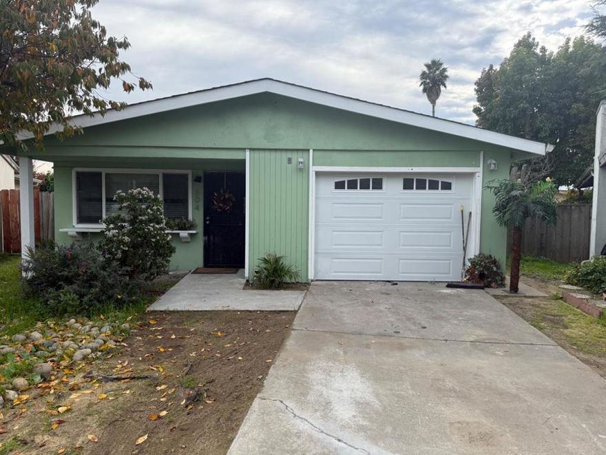 Located in the 55+ Bay Village Adult community on a quiet street across from a redwood studded park, this 2 bedroom, one bath home sits on a 6,534 sq ft lot making it a gardners delight with many fruit trees. large concrete patio and storage shed.The home suffered a garage fire in 2024 and has since been extensively repaired and upgraded with permits, including all new HVAC, water heater, furnace, paint, garage door, wiring, LED lights, new bathroom, ceiling insulation, all new flooring throughout. Washer, dryer, refrigerator and stove included. A great, peaceful location waiting for a "green thumb".
