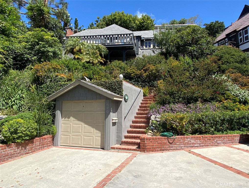 THE PERFECT LAGUNA BEACH PARTIAL-YEAR RENTAL – Available now to December 31, Full Term, including the most desirable summer months. (No shorter term or monthly stays – sorry! ) Fully furnished and Beautifully maintained Laguna Cottage over gardens perched on a hillside above the street. Light and Airy. Ocean, Island and Sunset views. Vintage hardwood flooring. Walk to downtown and beaches. Lots of modern conveniences. Central AC. Plenty of Indoor-Outdoor living spaces for entertaining and BBQing and dining -- or just relaxing.
Plus, there are two additional garden patios with seating. Additional outdoor beach-shower on the upper back deck. Off street parking plus a single stall garage. Close to nearby downtown restaurants, entertainment and beaches. Ideally located on a quiet one-way culdesac away from the busier zones. One of a kind -- Annual rental/ Available now to Dec, furnished rental. Walk thru video available.