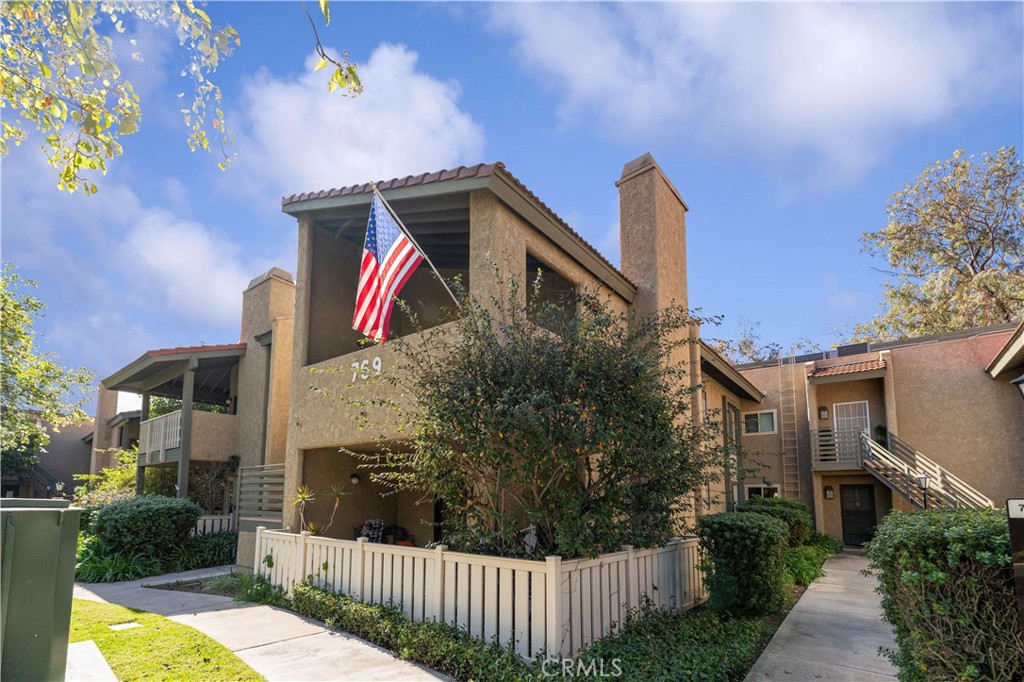 Welcome to Oaknoll Villas, a highly sought-after 55+ community offering resort-style amenities and prime location. Meticulously kept top-floor end unit features an open floor plan, vaulted ceilings, a new ceiling fan, a cozy fireplace and luxurious vinyl flooring throughout. The spacious living and dining area flows seamlessly to a large private balcony. The super clean kitchen has newer appliances, including refrigerator, range, microwave and dishwasher. Enjoy the convenience of YOUR OWN LAUNDRY UNITS. The large suite with vaulted ceilings has a huge walk-in closet. Residents of Oaknoll Villas enjoy a pool, spa, clubhouse, fitness center, billiards, library, outdoor BBQs, shuffleboard, and more. The HOA covers Wi-Fi-internet, Direct TV, trash and earthquake insurance, providing worry-free living. Ideally located near hiking trails, parks, shopping centers, Thousand Oaks Mall, movie theaters, and dining. This home offers comfort, convenience, and an active lifestyle. Don't miss this opportunity to own one of the area's most prestigious 55+ communities! You can also see your carport/parking from the balcony.