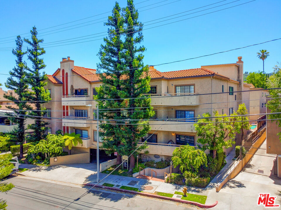 Craving a fresh, modern space in the heart of Sherman Oaks? This newly remodeled condo offers relaxed luxury just moments from the vibrant shops and restaurants of Ventura Blvd. From the warm wood-style flooring to the crisp white palette throughout, every inch feels thoughtfully created. The kitchen features all the appliances you need with bar seating on one side and a casual breakfast nook on the other, ideal for both quick bites and leisurely mornings. An open dining area framed by a row of street-facing windows flows into the living room with built-in cabinetry, a fireplace, and a wet bar for entertaining. Slide open the glass door to your private balcony for morning coffee or evening sunsets. Two bedrooms and two bathrooms provide comfort and space, including a main suite with dual sinks, soaking tub, and a separate shower. Enjoy resort-inspired living with a community pool, all in an ideal location you can't go wrong with. Ready to live where style meets convenience?