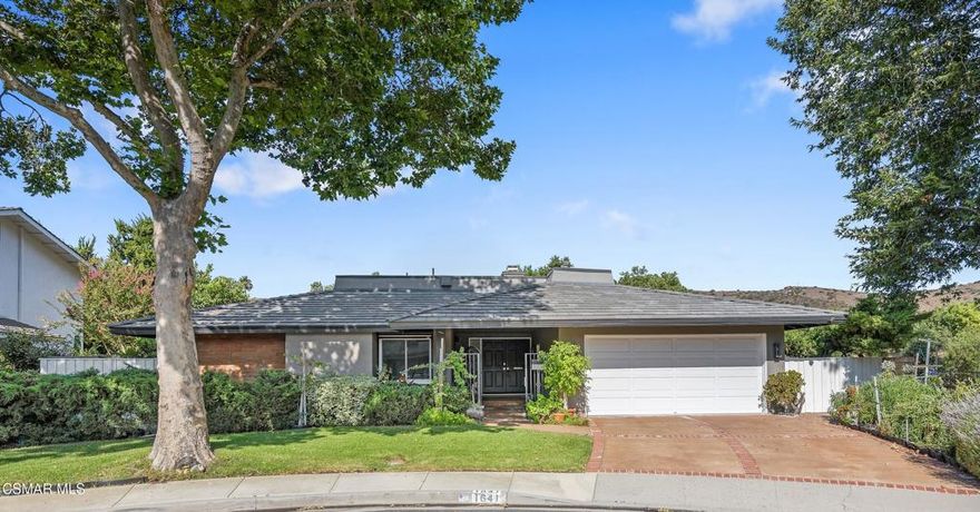 Welcome to this beautifully updated 4 bedroom, 2 bathroom single story home in Westlake Village! The open floor plan features views of the scenic outdoors and soaring ceilings in the family room and primary bedroom. Note the attractive engineered hardwood flooring. The updated kitchen has granite countertops, center island, and roomy pantry. Notice the added wall units in the entry, family room, central bathroom, and primary bedroom that are ideal for storage. Solar panels are found on the recently replaced roof. The sun-filled home includes spacious,newer windows and sliders to the scenic grounds near hiking trails and open space. The oversized patio is ideal for outdoor dining and relaxation. Home's  cul de sac location is beside the Foxmoor greenbelt with its scenic walkway to the community pool, clubhouse and an elementary school.  Enjoy living here!
