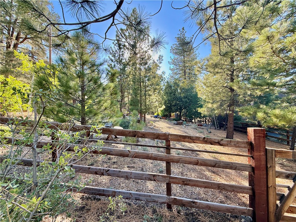 Imagine waking up each morning to crisp mountain air and breathtaking views — now make it a reality. This nearly 1/4 acre of beautifully flat land is perfectly nestled in the sought-after Pine Mountain Club community. Whether you're envisioning a cozy cabin retreat or a modern mountain getaway, this lot is ready to bring your dream to life. Fenced property with park like setting, charming country garden shed and raised planting beds.
Water and electricity available — simplifying your build and reducing upfront costs. Adjacent 4 bedroom and 3 bath home at 1900 Teton Way is beautifully landscaped and is available for sale at $585,000.
Tucked away in one of California’s best-kept secrets, Pine Mountain Club offers a peaceful lifestyle surrounded by nature, wildlife, and starlit skies. The community clubhouse is also close by, offering dining, entertainment, and an array of recreational activities including golf, tennis, pickle-ball and swimming. For outdoor enthusiasts, Pine Mountain Club boasts extensive hiking and biking trails, fishing, cross-country skiing, and an equestrian center, ensuring there's always something exciting to do. Pine Mountain Club is just 90 minutes from Los Angeles and a 2-hour drive to the beach, making it an ideal retreat from the hustle and bustle of city life while still being within reach of urban convenience.