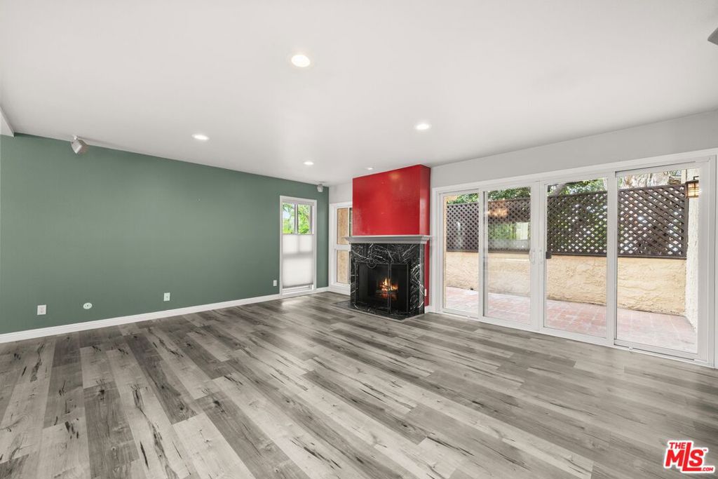 This spacious 2-bedroom, 3-bath townhouse in the heart of Sherman Oaks offers nearly 1,600 square feet of bright and comfortable living, thoughtfully updated with modern essentials and ready for your personal touch. The open-concept main level features a large living room with a cozy fireplace flowing seamlessly into a formal dining area and updated kitchen, ideal for both everyday life and entertaining guests. The living room opens to a private rebuilt deck, perfect for morning coffee or evening relaxation. Upstairs, you'll find two generously sized en-suite bedrooms, including a primary retreat with a large walk-in closet and full bath. On the bottom floor, you have an oversized 2 car garage with PLENTY of storage space, a large laundry area, and direct access to the unit. Enjoy peace of mind with key upgrades already in place: dual-pane windows, updated copper plumbing, a new electrical panel, NEST thermostat with newer HVAC, and a recently replaced roof. This community is beautifully maintained and features a pool, spa, clubhouse, and lush grassy areas all with low HOA dues and earthquake insurance included. Just minutes from Ventura Blvd, major freeways, shops, restaurants, and houses of worship, this inviting townhouse offers the convenience you want with the flexibility to customize over time. A smart investment and a warm place to call home don't miss it!