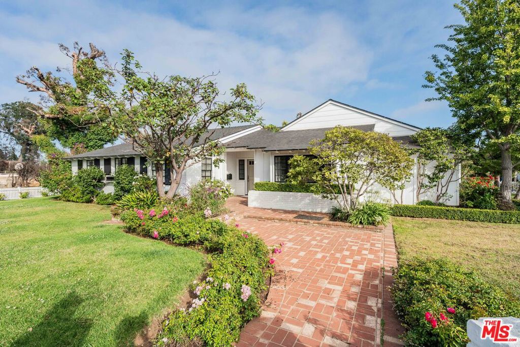 Traditional 5-bedroom, 4-bathroom home on a 12,146 sq ft corner lot in the desirable Huntington Palisades. With 2,604 sq ft of living space, the home features a welcoming living room with a fireplace and built-ins, as well as a formal dining room with crown molding and a marble-top credenza. The spacious family room includes high ceilings, a fireplace, a built-in TV, a wet bar, a Sub-Zero wine fridge, and a Viking ice maker. The kitchen features a marble center island, a Viking 6-burner cooktop and oven, a Sub-Zero refrigerator, a spice cabinet, a walk-in pantry, and a butler's closet adjacent to a laundry room with a sink and storage. The primary suite features a fireplace, built-in storage, and two cedar-lined walk-in closets. The en-suite bath features dual marble vanities, separate tub, and shower. A guest bedroom with a bath is located above the detached two-car garage, which features built-in storage. The backyard features a covered patio, pool, outdoor TV, and a built-in BBQ with a slate island and sink. Close to the Village, top schools, hiking trails, and the beach. A rare lease opportunity in a prime Palisades location.
