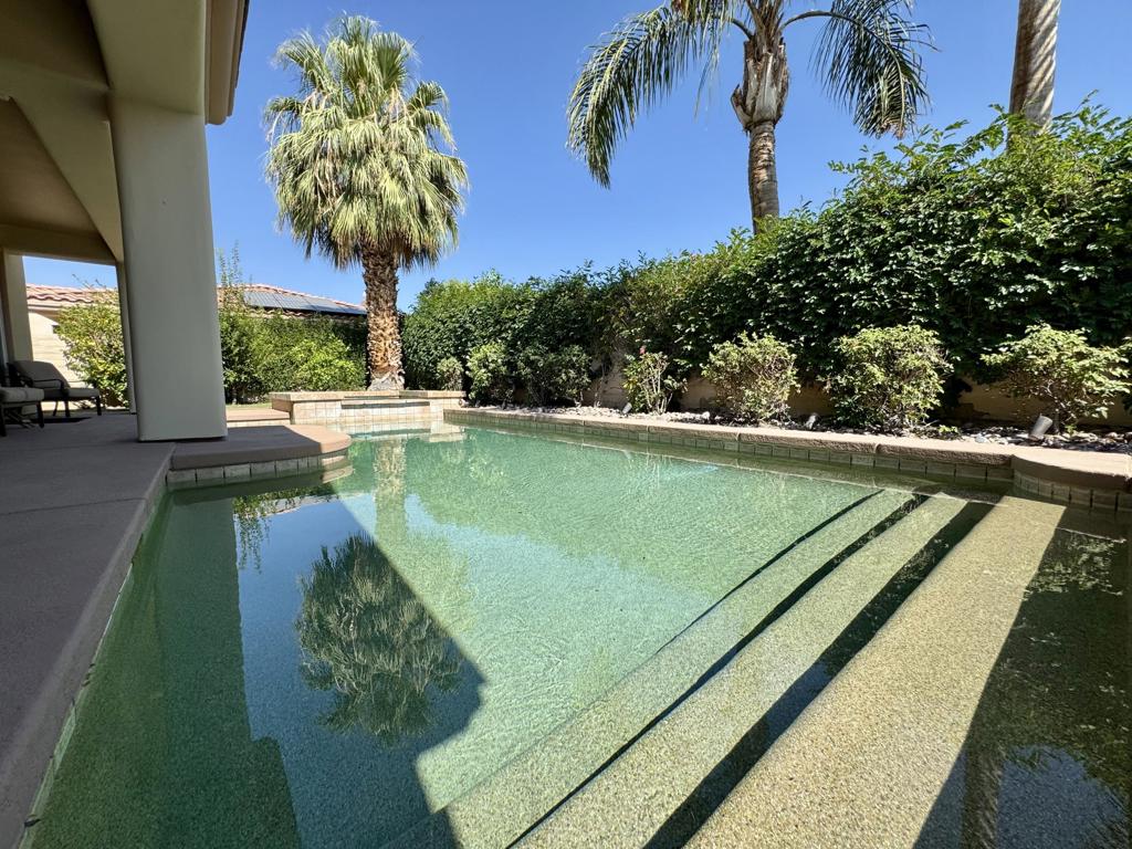 This stunning 3-bed/3.5 bath, 2129 SF house is the perfect place to embrace the desert lifestyle. It features a pool and spa with pebble tech, salt system and built in BBQ, island, with a sink. All of this in the private backyard and patio with rose bushes and fruit trees makes cooling down and enjoying the desert feel like a year round vacation. Additionally, this house has a 3-car garage and sits on a cul-de-sac. The house layout is a modern, open floor plan that highlights split bedrooms and a breakfast bar with easy access to the living room and home office. It also features stainless steel appliances, newer granite countertops, a newer sink and garbage disposal, newer lighting over the island area, newer washer and dryer, and a newer paint job throughout the house. This house is situated in one of Rancho Mirage's most desirable gated communities, La Terraza, which has low HOA, land ownership, and is centrally located between the I-10 freeway, Hwy 111, Eisenhower Hospital, El Paseo, The Shops at Palm Desert, Restaurants, and other key areas. The house has been professionally cleaned (including the windows), so it is ready to move in. Come see this gorgeous house today!
