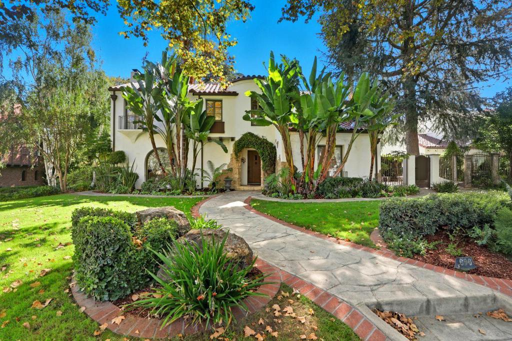 Welcome to this exceptional 1928 Spanish Hacienda style estate, an architectural gem in San Joses prestigious Naglee Park. Gated and private, this 4BD/3BA residence offers 3,901 sq. ft. of refined living on nearly 2/3 acre of landscaped grounds. Inside, Old-World craftsmanship blends seamlessly with modern updates. A dramatic mahogany foyer opens to a sun-filled formal living room with grand fireplace ideal for entertaining. The open chef's kitchen features new stone countertops, designer tile, Sub-Zero refrigerator, and Bertazzoni appliances including double ovens and a 5-burner cooktop, plus a sous prep area. The upper-level primary suite is a private retreat with fireplace, Juliet balcony, and flexible sitting/office area. The remodeled ensuite boasts dual vanities, custom shower, and generous walk-in closet. A finished 400 sq. ft. basement adds versatility with kitchenette, wine cellar, and walk-out access to the stunning yard. Outdoors, enjoy a resort-style setting with flagstone patios, pool/spa, bocce court, alfresco kitchen, terraced lawns, rose garden, raised beds, and children's play area. Three-car garage plus space for pool house or ADU. Prime location minutes from Downtown San Jose, with easy access to 280/680/101/87 and top employers like Adobe, Google, and Zoom.