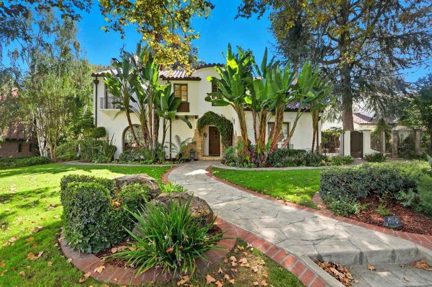 Welcome to this exceptional 1928 Spanish Hacienda style estate, an architectural gem in San Joses prestigious Naglee Park. Gated and private, this 4BD/3BA residence offers 3,901 sq. ft. of refined living on nearly 2/3 acre of landscaped grounds. Inside, Old-World craftsmanship blends seamlessly with modern updates. A dramatic mahogany foyer opens to a sun-filled formal living room with grand fireplace ideal for entertaining. The open chef's kitchen features new stone countertops, designer tile, Sub-Zero refrigerator, and Bertazzoni appliances including double ovens and a 5-burner cooktop, plus a sous prep area. The upper-level primary suite is a private retreat with fireplace, Juliet balcony, and flexible sitting/office area. The remodeled ensuite boasts dual vanities, custom shower, and generous walk-in closet. A finished 400 sq. ft. basement adds versatility with kitchenette, wine cellar, and walk-out access to the stunning yard. Outdoors, enjoy a resort-style setting with flagstone patios, pool/spa, bocce court, alfresco kitchen, terraced lawns, rose garden, raised beds, and children's play area. Three-car garage plus space for pool house or ADU.  Prime location minutes from Downtown San Jose, with easy access to 280/680/101/87 and top employers like Adobe, Google, and Zoom.