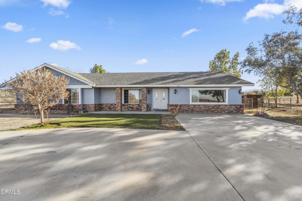 This 1.25-acre Littlerock, California home offers the perfect blend of comfort, beauty, and versatility. Set in a quiet, close-knit community with breathtaking mountain views, it boasts undeniable curb appeal, a welcoming roundabout driveway, and brand-new floors throughout. Inside, generous shared living spaces are ideal for family gatherings, while a well-appointed kitchen offers abundant storage. A separate entrance addition provides flexibility for guests, extended family, or potential rental income. With a motivated seller ready to make a deal, this property is a rare opportunity to enjoy peaceful living with room to fit your lifestyle. For a different price, the owner is also offering the adjacent 1.25-acre lot, bringing the total to an impressive 2.5 acres.