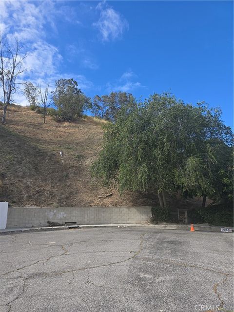 Photo of 12025 Adrian Place, Granada Hills, CA 91344 (MLS # SR26091590)