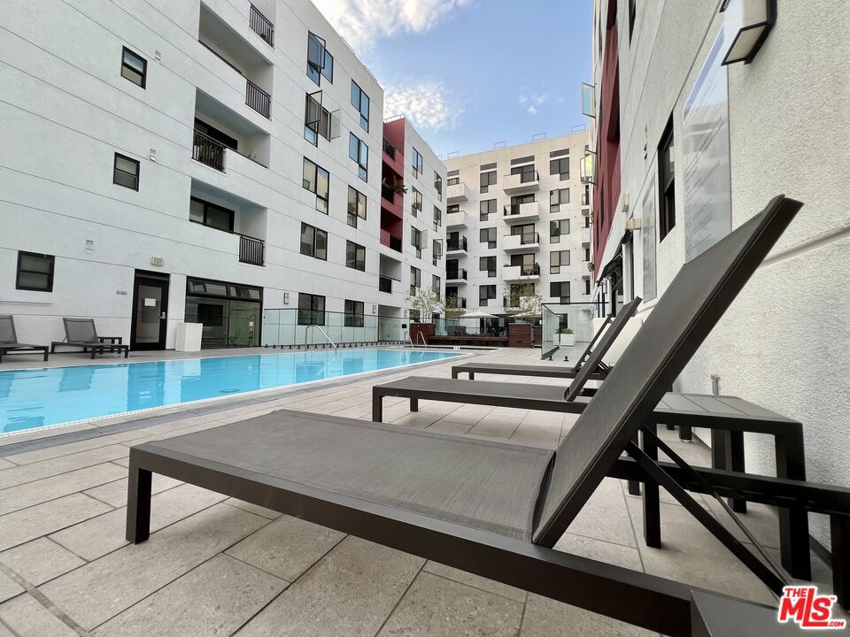 Elevate your lifestyle in the vibrant heart of Los Angeles with this exquisite 1-Bedroom, 1-Bathroom condominium designed to combine contemporary elegance with unbeatable urban convenience. Step inside to an open-concept living area flooded with natural light, featuring premium hardwood flooring throughout the main living space and plush carpet in the bedroom, which includes 2 side by side closets and direct access to the full bathroom with sleek finishes. The gourmet kitchen boasts European-style modern cabinetry, brushed stainless steel appliances, and ample counter space. Additional perks like in-unit washer/dryer, central air conditioning, a private balcony offering glimpses of the city skyline. The unit also features 2 garaged tandem parking spaces and an ample storage cage. Vero redefines resort-style living with upscale on-site features including a resort-inspired pool and spa with lounging deck, state-of-the-art fitness center, rejuvenating sauna, secure gated entry and 24-hour concierge service, community BBQ grills, high-speed WiFi in common areas, and elevators for seamless access. Situated on the iconic Wilshire Boulevard corridor, you're minutes from Crypto.com Arena, Walt Disney Concert Hall, and the Financial District. Schedule a showing today.