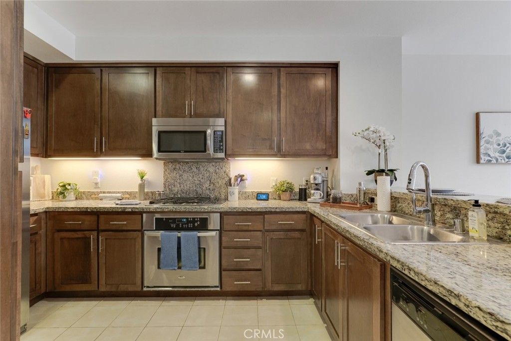 Photo of 21301 Erwin Street #228, Woodland Hills, CA 91367 (MLS # BB26074183)