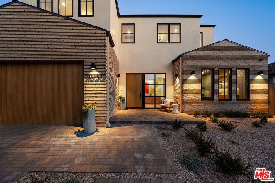 Welcome to this stunning, organic, contemporary modern, new construction in the heart of Westdale Trousdale/ Mar Vista. Thoughtfully crafted with the highest quality materials and sophisticated styling, this highly sought after flowing open floor plan features exemplary finishes, custom cabinetry, and seamless attention to detail, setting it in a class of unparalleled luxury and design. Downstairs, you'll find a private office, mud room, powder room with travertine accents, and an expansive living and dining area anchored by a sleek fireplace and custom wood elements. The chef's kitchen is a culinary dream, featuring top of the line appliances and walk-in pantry. Distinctive to the home's cutting edge design elements, Casement windows flood the space with natural light, with a full wall of retractable glass seamlessly creating a blend of indoor and outdoor living. The large private backyard has it all, including mature trees, grass area, patio, pool, and spa with waterfall, perfect for outdoor entertaining. The ADU offers incredible flexibility, complete with its own kitchen, bath, and a studio-style layout for sleeping and office use. A loft lounge meets you at the top of the stairs followed by three en-suite bedrooms, plus the primary suite. The primary suite, generous in size is nothing short of impressive, with vaulted ceilings, custom oak finishes, a spa-like bathroom with freestanding tub and triple-head shower, and a totally "custom organized" walk-in closet. Additional highlights include wide plank floors, 10-foot ceilings, rich wood accents, wall and ceiling treatments, CAT-6 prewiring, and abundant storage throughout. With modern riffed white oak exterior accents and a custom stone driveway, this home caters to today's uncompromising lifestyle without exception.
